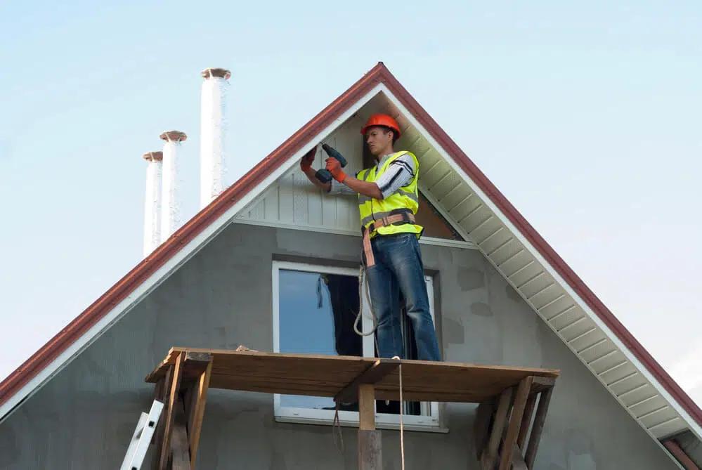 man installing fascia