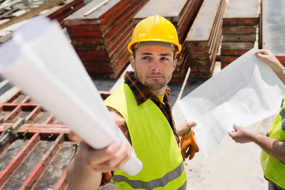 roof contractor holding blueprint