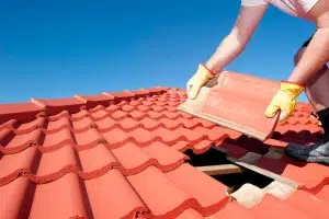 A Man repairing a residential roof