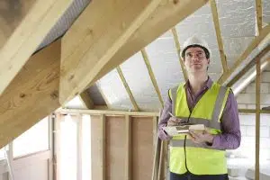 man inspecting the roof