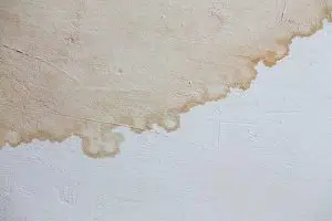 wall stains due to commercial roof leaks
