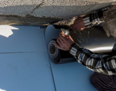 worker installing tpo roof