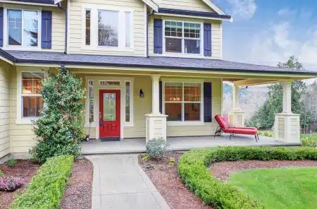 classic American home with light yellow exterior
