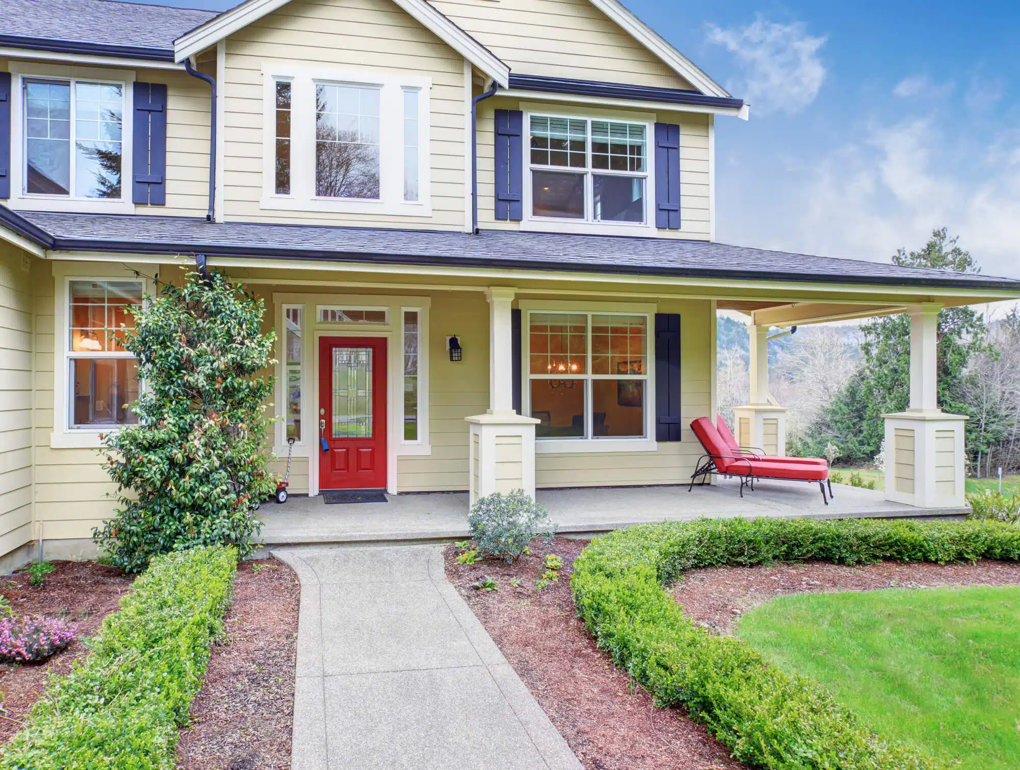 classic American home with light yellow exterior
