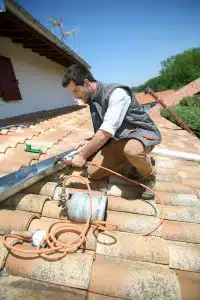 main doing work on the roof