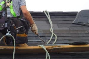 worker doing roof maintenance