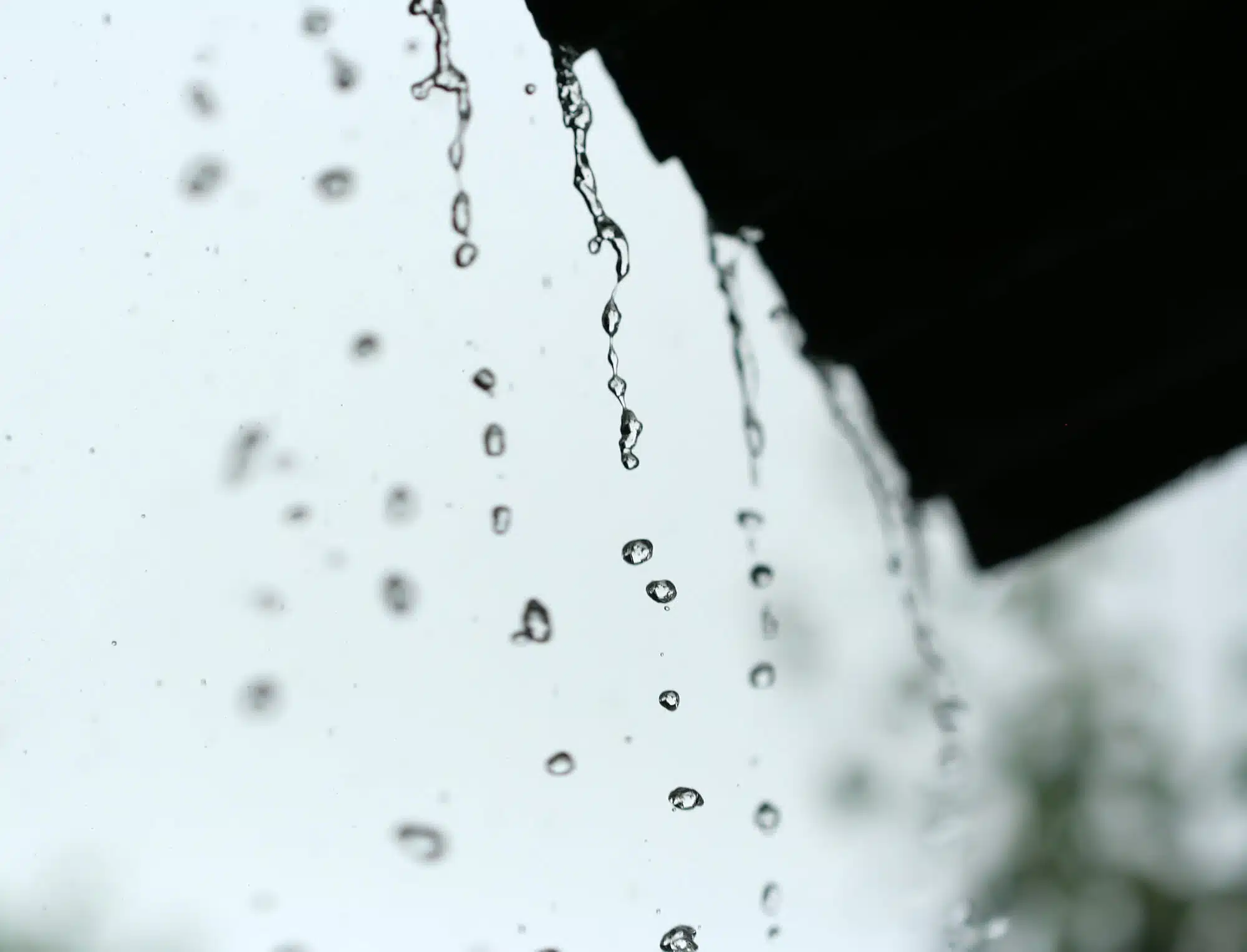rainwater dripping from the roof