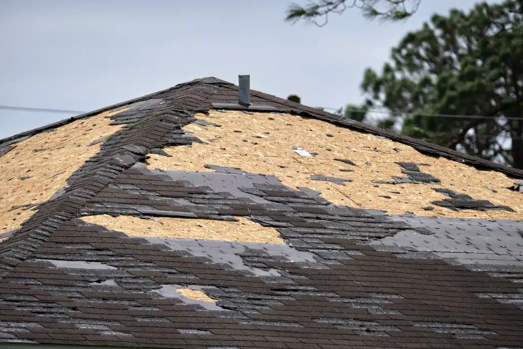 Wind damaged house roof 