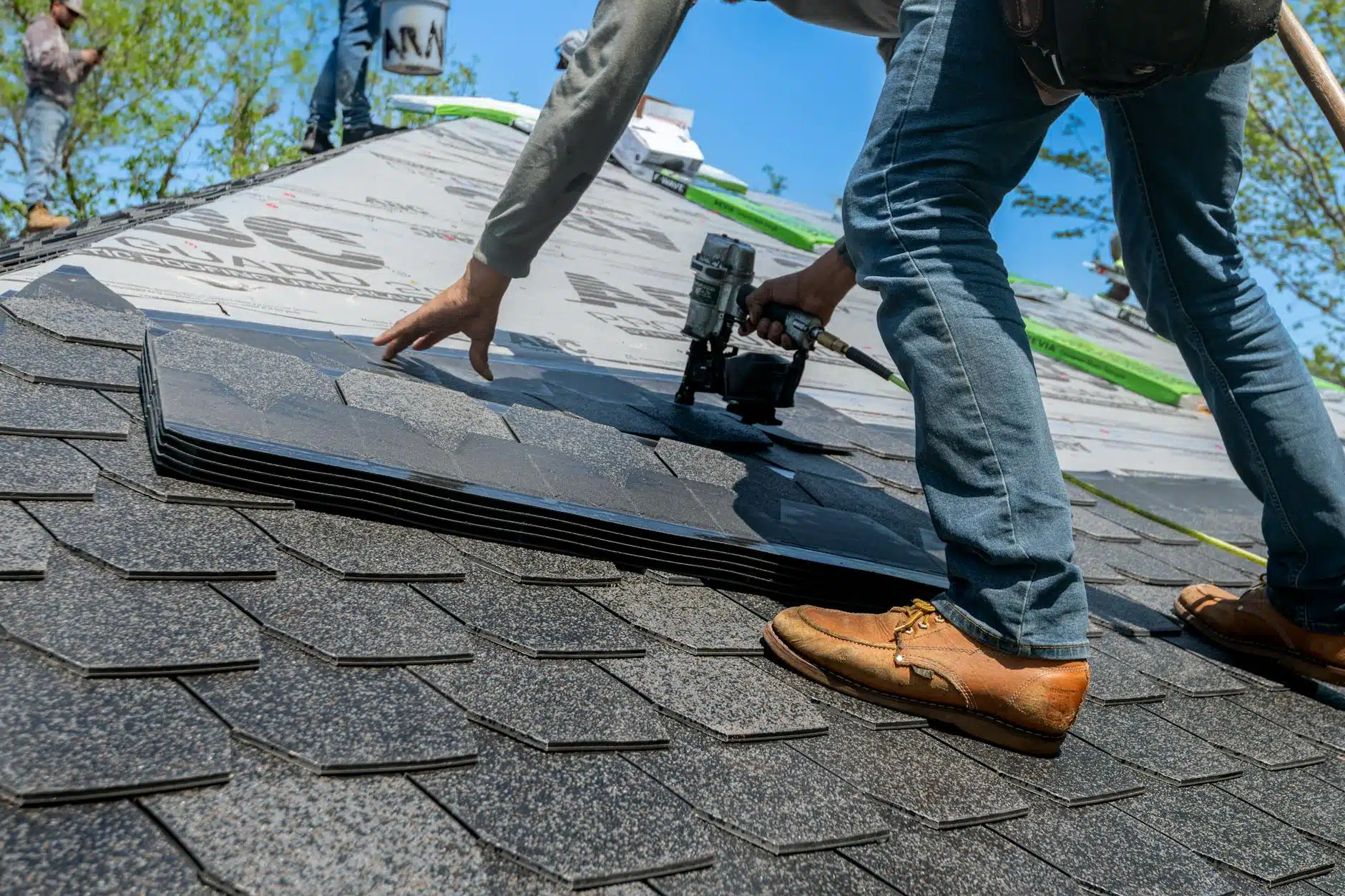 roofers working on new roof installation